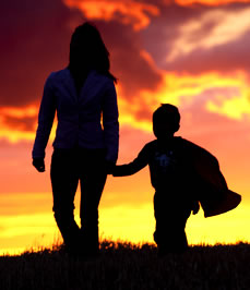 Mother and Son holding hans.