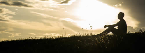 Guy watching sunset