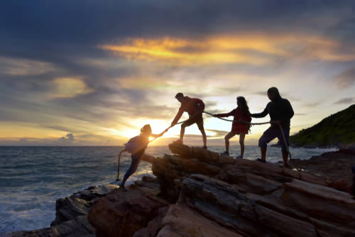 Hikers climbing mountain