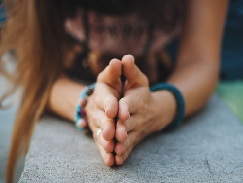 Female hands praying