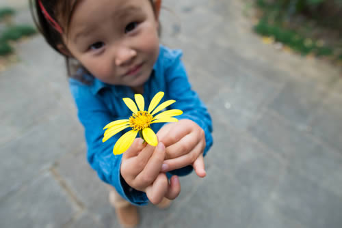 Child with flower