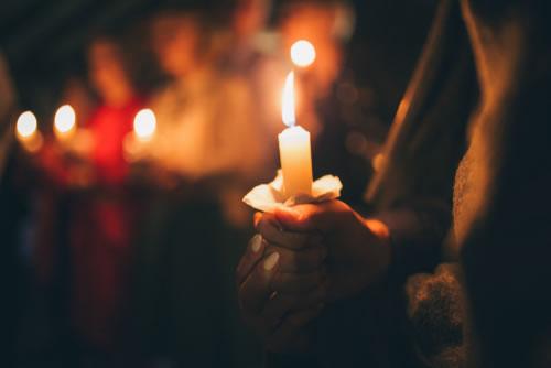 Girl holding candle.