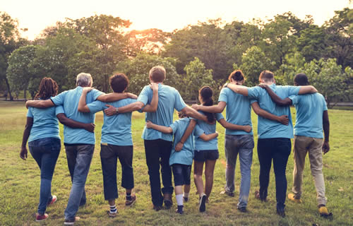 Group with arms around each other