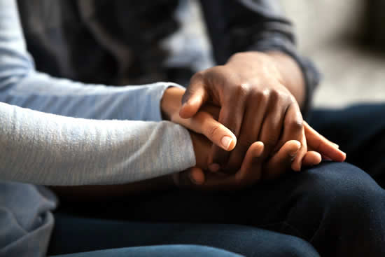 Couple holding hands