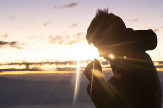 Young man praying