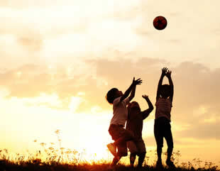 Three kids with a ball.