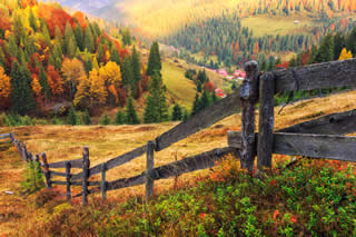 A monutain and a farm in autumn