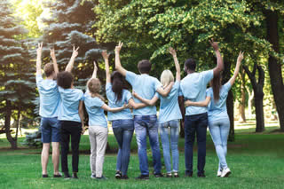 Group in front of trees celabr celebrating