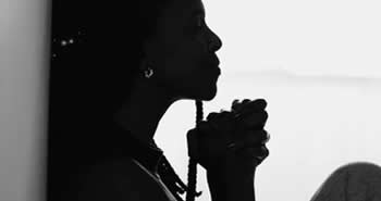 Black woman praying